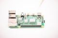 Kiev, Ukraine - AuClose-up of a powered Raspberry Pi 4 Model-B on a white background. The RPI4 is a credit-card-