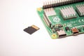 Kiev, Ukraine - August 13th, 2020: Microcomputer Raspberry Pi 4 with a microsd card lying next to it, ready to use for its