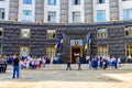 Ukrainian officials and ministers near the Building of Cabinet of Ministers during celebration of Day of State Flag of Ukraine in