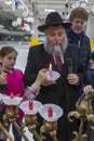 02.09.2019 Kiev, Ukraine. the chief rabbi of the city of Kiev lights candles with children at the festival of Hanukkah