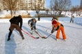 Kiev, Ukraine, 19.02.2012 Children and one adult play hockey on a skating rink Royalty Free Stock Photo