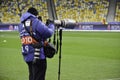 KIEV, UKRAINE - DEC 06: A press photographer with a long lens ta