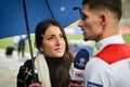 KIEV, UKRAINE - December 12, 2018: Beautiful girl journalist interviews Houssem Aouar during the UEFA Champions League match