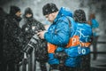 KIEV, UKRAINE - December 12, 2018: Photographer and journalist working with the camera viewing pictures during the UEFA Champions