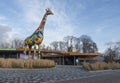 A sculpture of a painted giraffe at the entrance to the Kiev Zoo