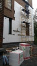 Kiev, Ukraine, Europe - October 2019: Facade work. Workers insulate the facade of a residential building. High-altitude work.