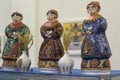 Kiev, Ukraine - February 25b 2018: Ceramic figures of women in ethnic clothes at the exhibition