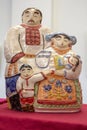 Kiev, Ukraine - February 25, 2018: Ceramic figures of a man and a woman in ethnic clothes at an exhibition