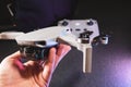 Dji Mini 2 new drone in hand close-up with remote