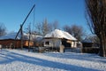 Traditional Ukrainian architecture. Old house with thatched roof and wooden church. Pirogovo museum, Kiev, Ukraine, Europe