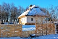 Traditional Ukrainian architecture. Old house with thatched roof and wooden church. Pirogovo museum, Kiev, Ukraine, Europe