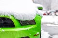 Kiev, Ukraine - February 09. 2018: Powerful Ford Mustang Boss edition parked outdoor under snowfall at bright winter day