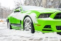 Kiev, Ukraine - February 09. 2018: Powerful Ford Mustang Boss edition parked outdoor under snowfall at bright winter day