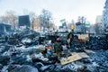 KIEV, UKRAINE: Group of guards of revolutionary barricades standing near the special forces on snow ruined street