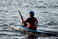 Kiev, Ukraine, 10.06.2020: A guy wearing a helmet on a canoe polo rowing a paddle and sailing on water. canupolo. puts on a rescue