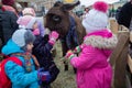 Kiev, Ukraine - January 13, 2018: Childrens feed animals in the zoo Royalty Free Stock Photo