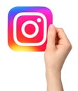 Hands holds Instagram icon Royalty Free Stock Photo