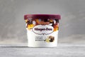 KIEV, UKRAINE - January 03, 2021: Mini cup of `Haagen Dazs` flavored vanilla ice cream with chocolate brownie