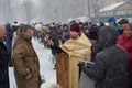 Kiev, Ukraine - January 18, 2018: Priest sprinkles the parishioners of the church with the consecrated water