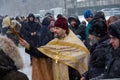 Kiev, Ukraine - January 18, 2018: Priest sprinkles the parishioners of the church with the consecrated water