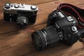 Kiev, Ukraine - January 21, 2019: Two cameras on the wooden background. Camera Canon