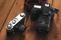 Kiev, Ukraine - January 21, 2019: Two cameras on the wooden background. Camera Canon