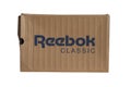 KIEV, UKRAINE-JULY 19,2017: blue Reebok sign with light brown background, Reebok International Ltd. - Sports shoe and sewing compa Royalty Free Stock Photo