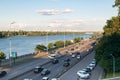 Kiev, Ukraine - July 21, 2023. City traffic. Many cars drive along theon the embankment