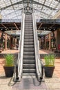 Kiev, Ukraine - July 6, 2019: Escalator Elevator Stairs Lift in Outlet Village called Manufaktura Shoping Center Looks Like