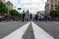 Kiev, Ukraine - July 14, 2019. Khreshchatyk st. White double dividing line. People on a day off. Guy riding a scooter Royalty Free Stock Photo