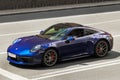 Kiev, Ukraine - June 12, 2021: Blue supercar Porsche 911 Carrera S in the city