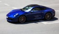 Kiev, Ukraine - June 19, 2021: Blue supercar Porsche 911 Carrera S in the city