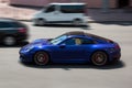Kiev, Ukraine - June 19, 2021: Blue supercar Porsche 911 Carrera S in the city. Porsche in motion