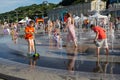 Kiev, Ukraine - June 10, 2018: Children bathe in the fountain in summer day Royalty Free Stock Photo