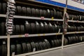 Kiev, Ukraine - June 10, 2019: Construction Rack with variety of car tires in automobile store