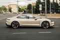 Kiev, Ukraine - June 19, 2021: Electric car Porsche Taycan on the road in the city. Porsche in motion