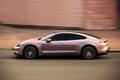 Kiev, Ukraine - June 19, 2021: Electric car Porsche Taycan on the road in the city. Porsche in motion