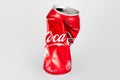 KIEV, UKRAINE - 25 June 2019: 330ml Coca cola crumpled can on white background. Royalty Free Stock Photo