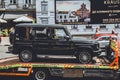 Kiev, Ukraine - June 19, 2021: New Mercedes G-class V8 being driven on a tow truck. New car Royalty Free Stock Photo