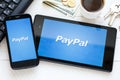 KIEV, UKRAINE - June 9 2014: PayPal payment system logo on tablet and smartphone