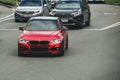 Kiev, Ukraine - June 12, 2021: Red matte BMW 328i car on the road