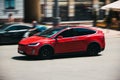 Kiev, Ukraine - June 19, 2021: Tesla Model X red electric car on the road. Tesla in motion Royalty Free Stock Photo