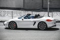 Kiev, Ukraine - June 19, 2021: White supercar Porsche Boxster in the city