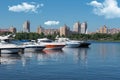 Kiev, Ukraine - June 01, 2018 : White yachts in the port, against the backdrop of the city. Yachts docked in river port