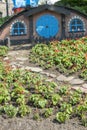 Kiev, Ukraine. Juny 20 2019 The little hobbit house. Themed flowerbed in the park. vertical photo