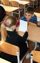 Kiev. Ukraine, 26.04.2010 The laughing schoolboy turned from the front desk to the schoolgirl sitting behind him in the classroom