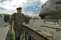 Kiev, Ukraine, 11.05.2009 Man in military form of the time of Second World War between two armored military car Royalty Free Stock Photo