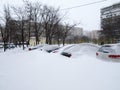 Kiev, Ukraine - MarÃÂh 23, 2013: Frozen and snow covered automobiles cars in the city yard