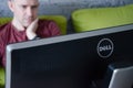 Kiev, Ukraine - March 22, 2021. Dell monitor in front of working caucasian man. Royalty Free Stock Photo