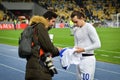 Kiev, UKRAINE - March 14, 2019: Football player gives autographed t-shirt during the UEFA Europa League match between Dynamo Kiev